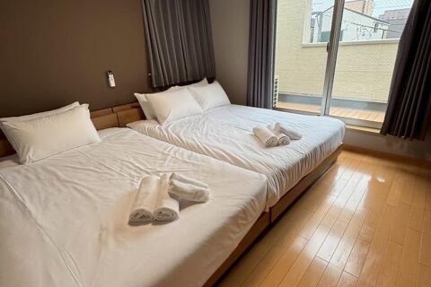墨田区押上3丁目 旅館 客室（ツイン・バルコニー採光）
